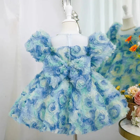 Girls Blue Floral Organza Dress with Puff Sleeves and Ruffled Petals