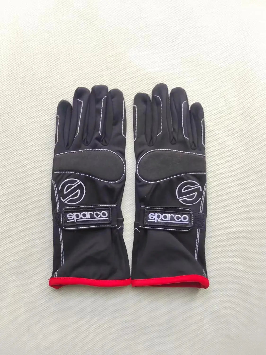 Mono de carreras bicolor OMP rojo y negro con paneles blancos