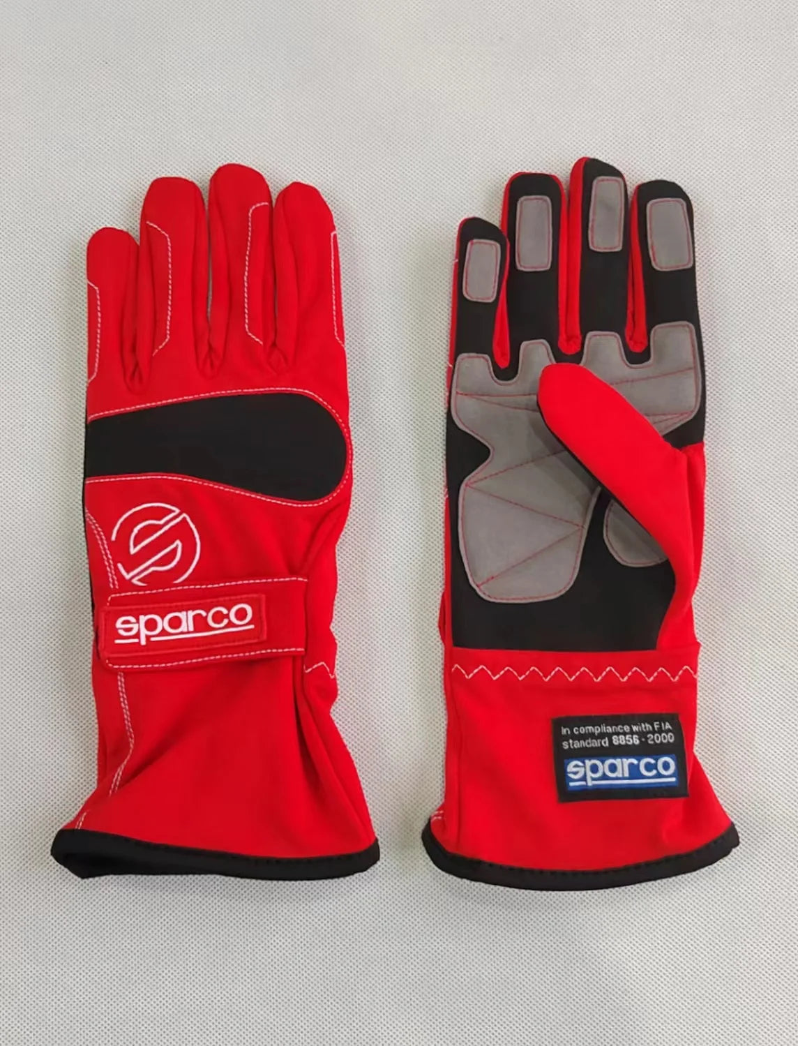 Mono de carreras bicolor OMP rojo y negro con paneles blancos