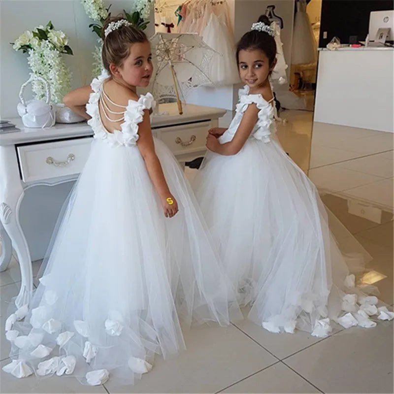 Girls White Flower Embellished Tulle Dress with Cascading Ruffled Straps and Train